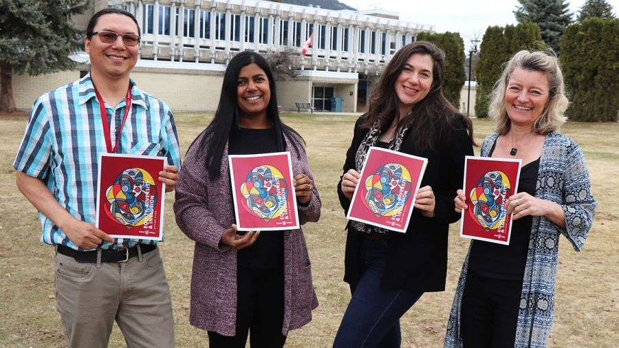 Members of EDI Committee hold action plan outside of Castlegar Campus.