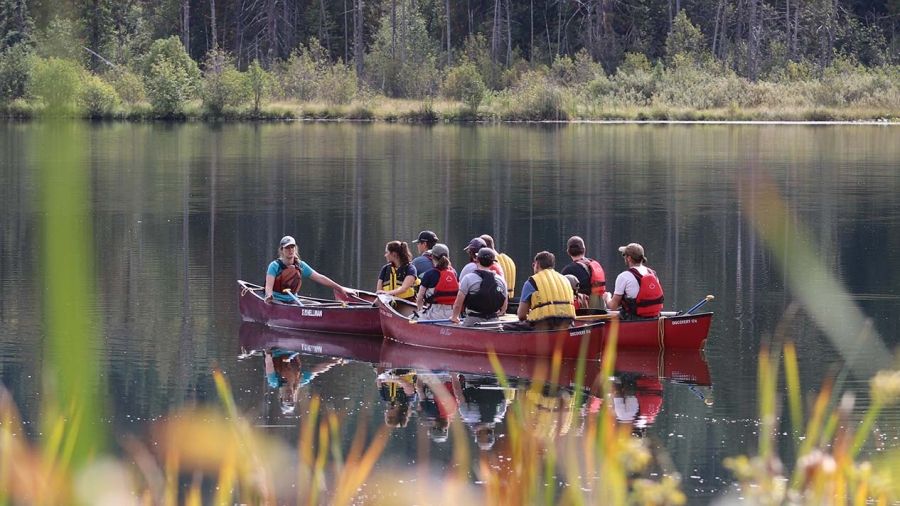 Photo of students learning on Erie Lake that is the cover image for the strategic plan